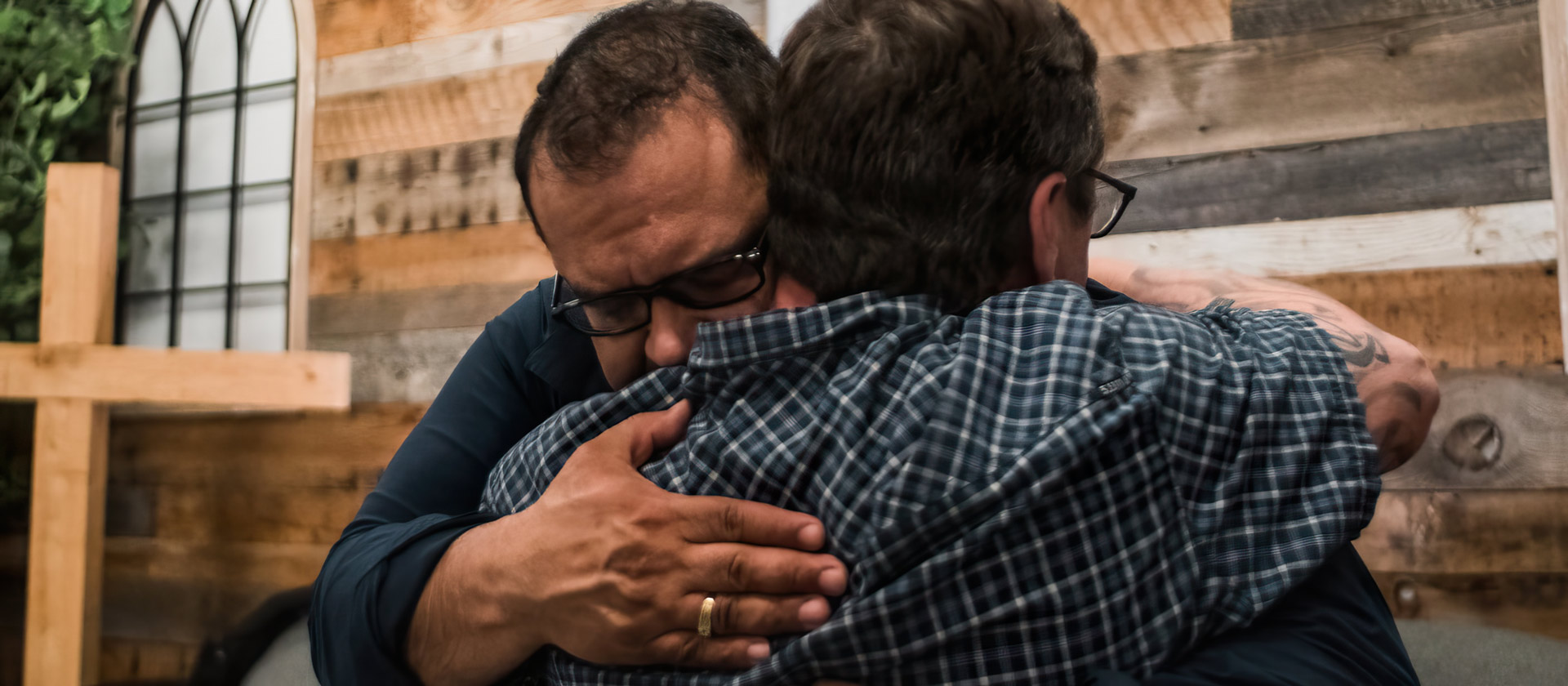 Two men hugging at church
